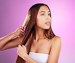 Hair care, brush and woman in studio for beauty cosmetics, skincare and salon color. Young model comb long hairstyle, textures and aesthetics for healthy shine, growth shampoo and body maintenance 