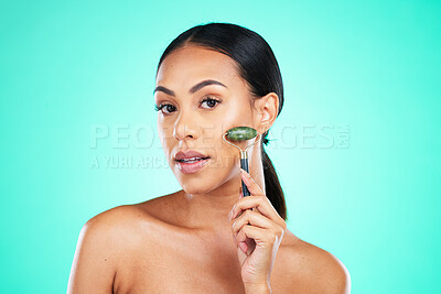 Buy stock photo Portrait, beauty and face massage with roller by woman in studio for wellness, grooming or cosmetic skincare. Facial and jade tool by girl model relax with skin product and isolated on background