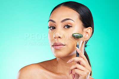 Buy stock photo Portrait, beauty and face massage with jade roller by woman in studio for wellness, grooming and cosmetic skincare. Face, facial and massaging tool by girl model relax with skin product and isolated