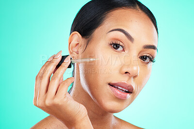 Buy stock photo Skincare, oil and portrait of woman in studio for beauty, wellness or cosmetic on blue background. Face, serum and girl for facial product for skin, anti aging or collagen, retinol or hyaluronic acid