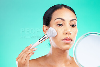 Buy stock photo Beauty, mirror and woman with makeup brush in studio for skincare, grooming and cosmetics on green background, Face, skin and girl relax with facial tool, glamour and product while isolated on mockup