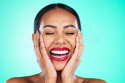 Buy stock photo Face, makeup and excited with a model black woman in studio on a blue background for skincare or cosmetics. Beauty, lipstick and satisfaction with a young female posing to promote a cosmetic product