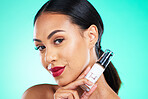 Beauty, cosmetic and portrait of a woman in studio with facial serum for skincare treatment. Cosmetics, face and female model from Mexico with natural makeup routine isolated by turquoise background.