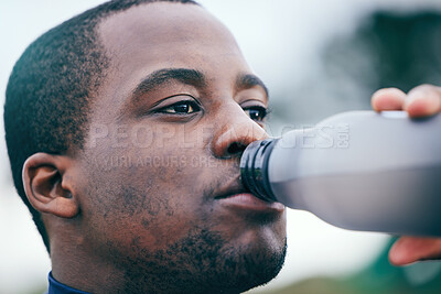 Buy stock photo Fitness, break and face of black man drinking water to hydrate after running, exercise and workout. Health, sports and African athlete with a bottle drink after training, sports and cardio in Germany
