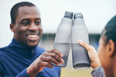 Buy stock photo Fitness, water bottle and black couple toast outdoors together after workout, exercise or training. Sports targets, celebration and man and woman cheers with liquid for hydration to celebrate goals.