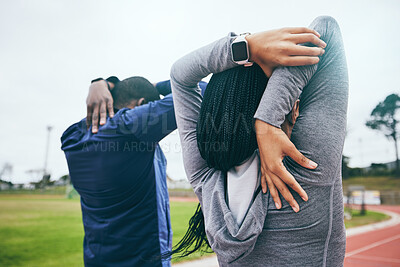 Fitness, back and black couple stretching arms outdoors for health and wellness at track. Winter sports, training and man and woman warm up, prepare or get ready to start exercise, workout or running