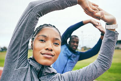 Buy stock photo Portrait, black woman on field and stretching for fitness, workout and training for wellness, health and balance. Exercise, man and African American female athlete stretch arms, outdoor and practice