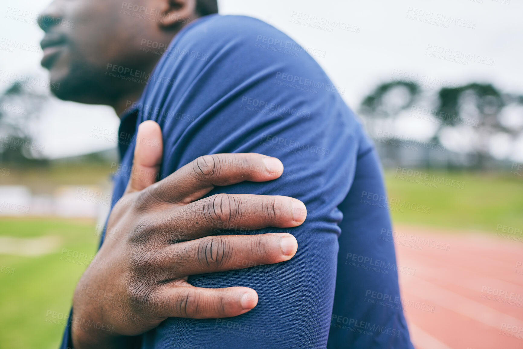 Buy stock photo Sports, hands and black man with pain in arm from exercise, workout and marathon training in stadium. Fitness, runner and athlete with joint strain, body injury and medical emergency on running track