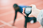 Sports, running and hands with stop watch on race track for exercise, marathon training and fitness. Stadium, workout and athlete team with timer for performance, lap speed and racing competition