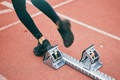 Buy stock photo Feet, running and race start blocks with woman athlete on stadium, motion blur and speed, action and fitness outdoor. Training, runner sneakers and sports training with exercise and cardio on track