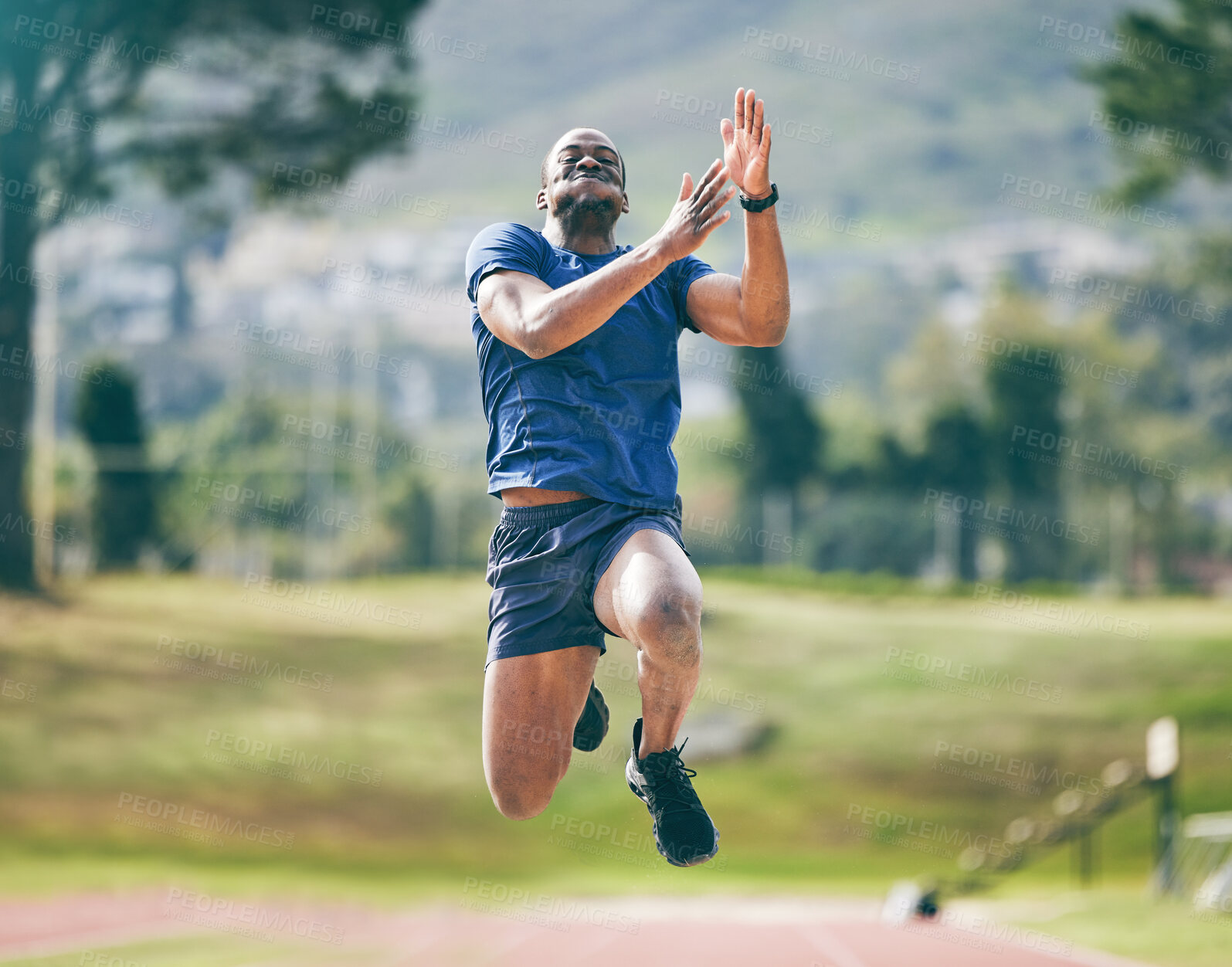Buy stock photo Black man, high jump and fitness exercise at stadium for training, workout or practice. Sports, wellness and male athlete exercising and jumping for performance, endurance and competition outdoors.