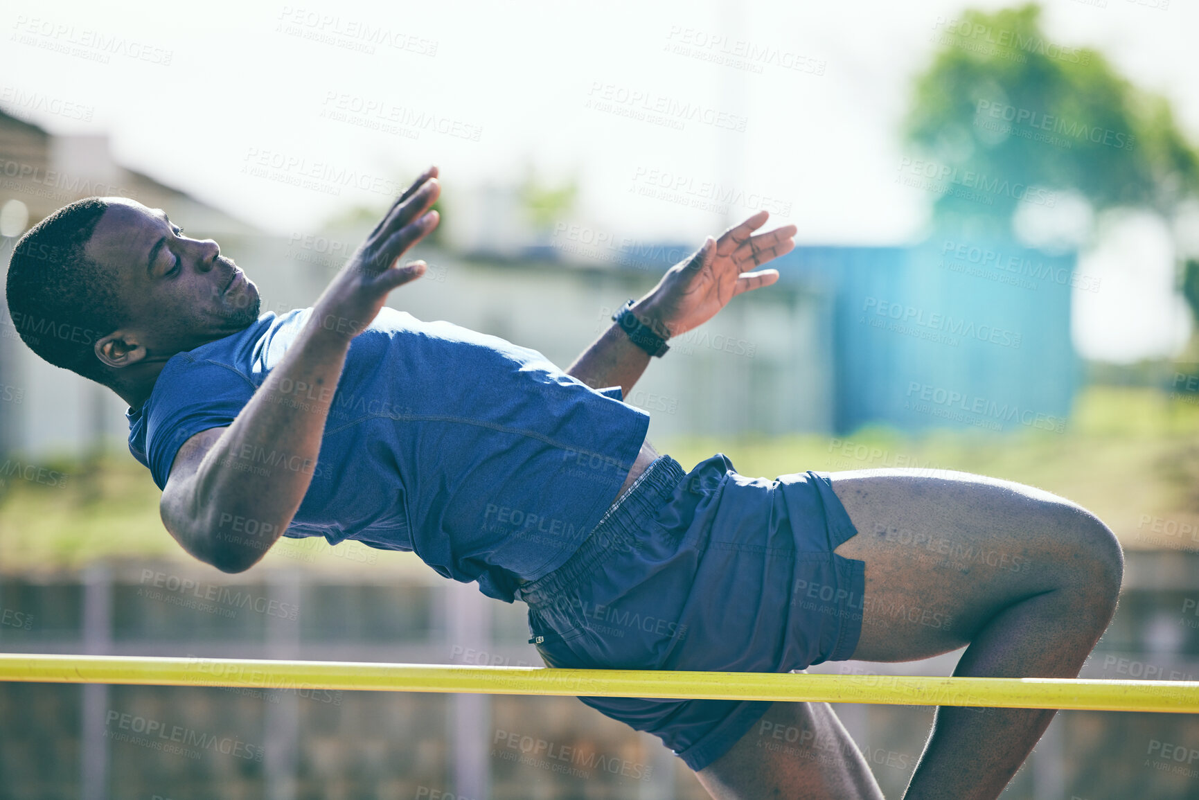 Buy stock photo Man, high jump and fitness or athletics at a stadium for training, energy and cardio against sky background. Jumping, athlete and male outdoors for performance, endurance and competition on mock up