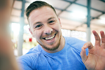 Buy stock photo Fitness, selfie and portrait of a man in a gym for exercise, cardio or sport training for wellness. Sports, health and face of a healthy male athlete with a ok gesture after a workout in a studio.