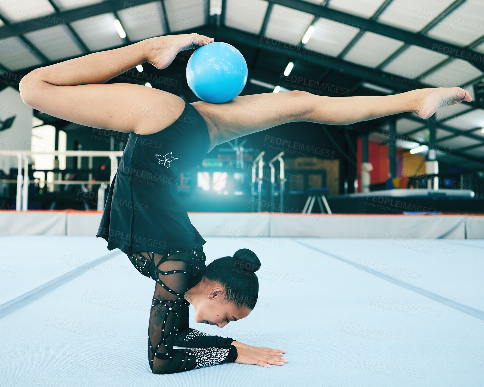 Buy stock photo Balance, gymnastics and woman stretching with a ball for a competition, practice or training. Fitness, sports and female athlete gymnast doing a flexibility, agility and endurance exercise in a gym.