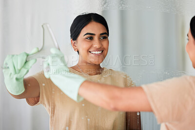 Buy stock photo Smile, reflection and woman cleaning mirror with spray bottle and soap, housekeeping in home or hotel. Happy housework, smudge and housekeeper or cleaner service washing dirt off glass in apartment.