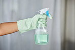 Spray bottle, detergent and maid with gloves for cleaning in a house, office or apartment. Hygiene, cleaner service and hand of a housekeeper with liquid for housework or sanitize dust, dirt or germs