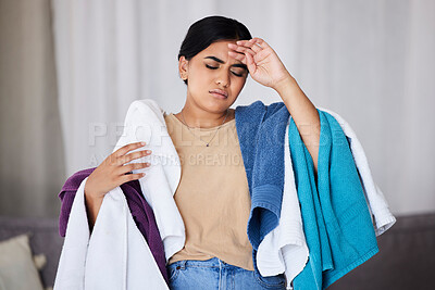 Buy stock photo Tired cleaner, Indian woman and laundry work in a house with cleaning and burnout. Maid, headache and stress of young person in a living room lounge feeling fatigue from housekeeper chaos in a house