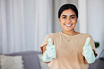 Woman, portrait smile and thumbs up for winning, cleaning or good job with domestic gloves on mockup at home. Happy female housekeeper smiling showing hand sign or emoji for great service or thanks