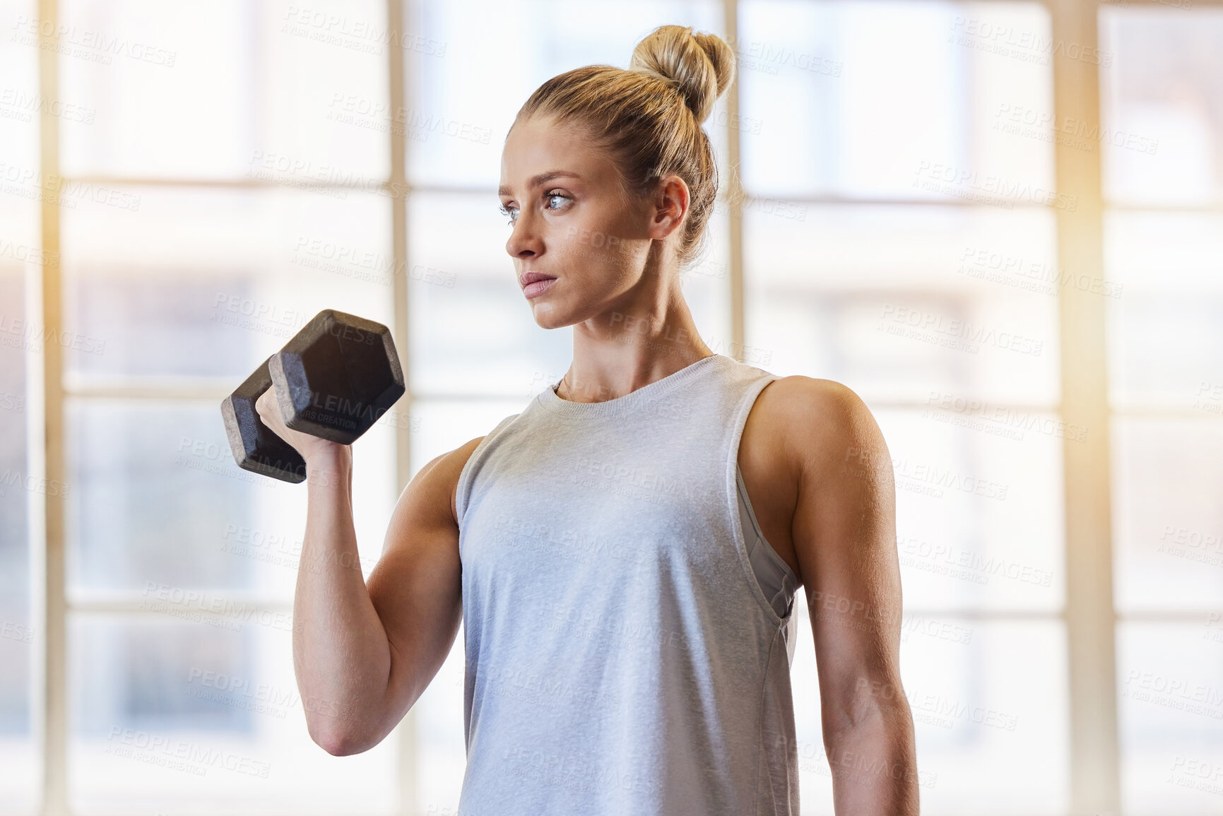 Buy stock photo Bodybuilder, dumbbell and woman in a gym for training, sports and exercise for wellness. Thinking, sports focus and athlete with weights for fitness and health workout performance for muscle
