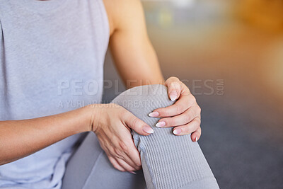 Buy stock photo Knee injury, woman hands and workout legs massage of a athlete in pain from training in a gym. Sports, exercise and workout leg accident in a health and wellness center with blurred background