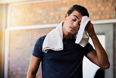 Buy stock photo Tired, sweat and man at gym for exercise, cardio or intense workout on brick wall background. Exhausted, athlete or male with towel stop to rest or recover from sport, performance or challenge 