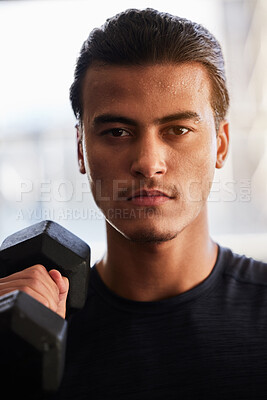 Buy stock photo Fitness, portrait or man with a dumbbell at gym training, exercise or workout for body goals or wellness. Motivation, sports or healthy athlete weightlifting for muscle growth isolated in studio