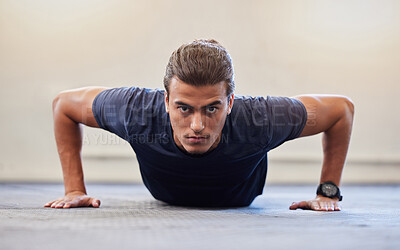 Buy stock photo Fitness, portrait or push up with man in gym training or exercising in a body workout for endurance. Healthy male, strong or powerful sports athlete focused on floor exercise challenge for wellness 