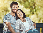 Couple, love and hug on park bench, laughing at funny joke or comic comedy and having fun together outdoors. Valentines day, romance relax and portrait of man and woman hugging on romantic date.