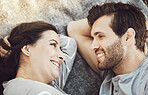 Love, couple romance and relax, talking and having fun time together outdoors on valentines day. Trust, support and face of happy man and woman lying on romantic date, smile and having conversation.