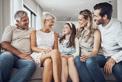 Buy stock photo Big family, love and relax on sofa in home living room, bonding or enjoying quality time together. Communication, care and happy grandparents, father and mother talking to girl, child or kid in house