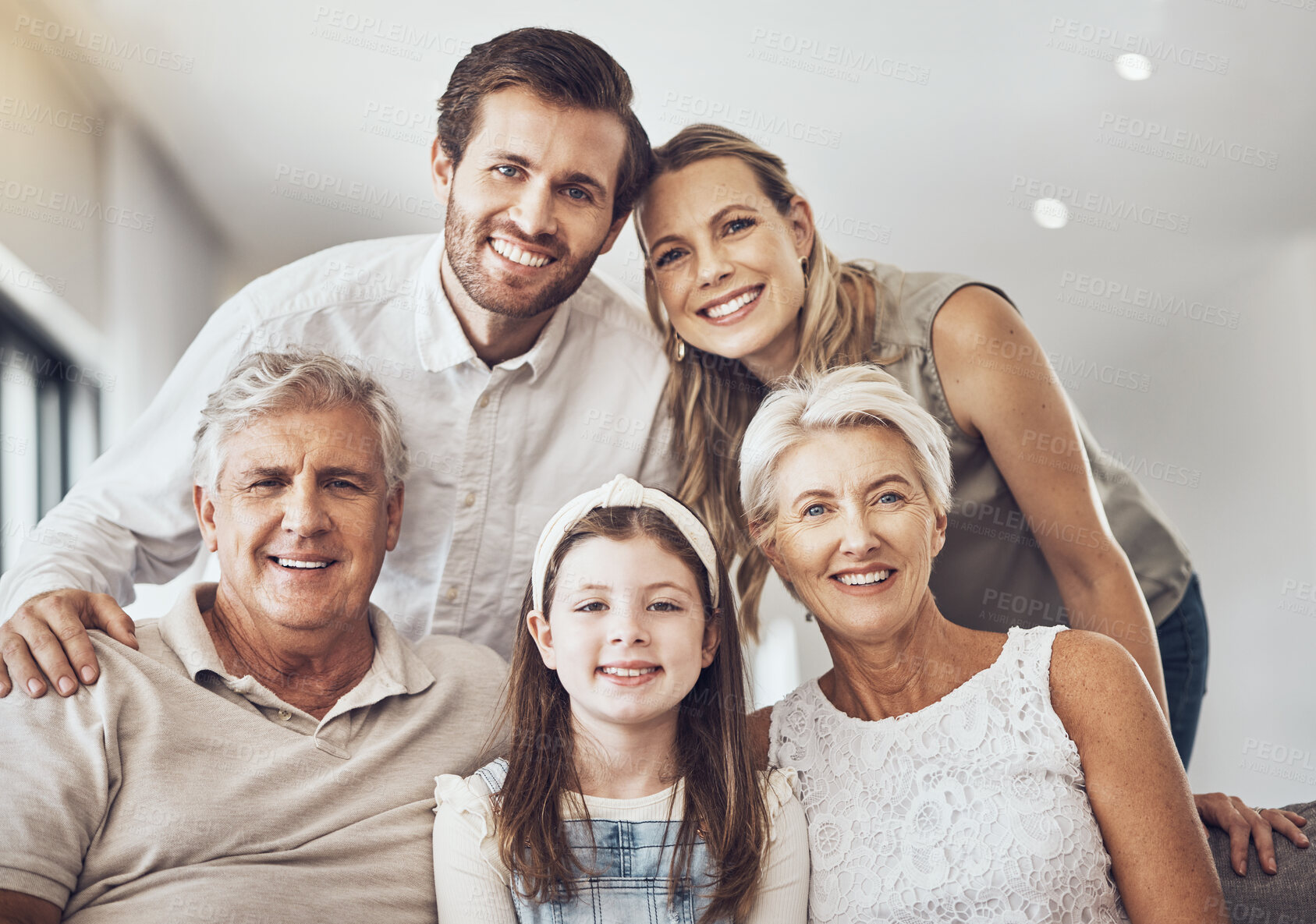 Buy stock photo Smile, big family and portrait on sofa in home living room, bonding and enjoying quality time together. Love, care and happy grandparents, father and mother with girl, child or kid relaxing on couch.