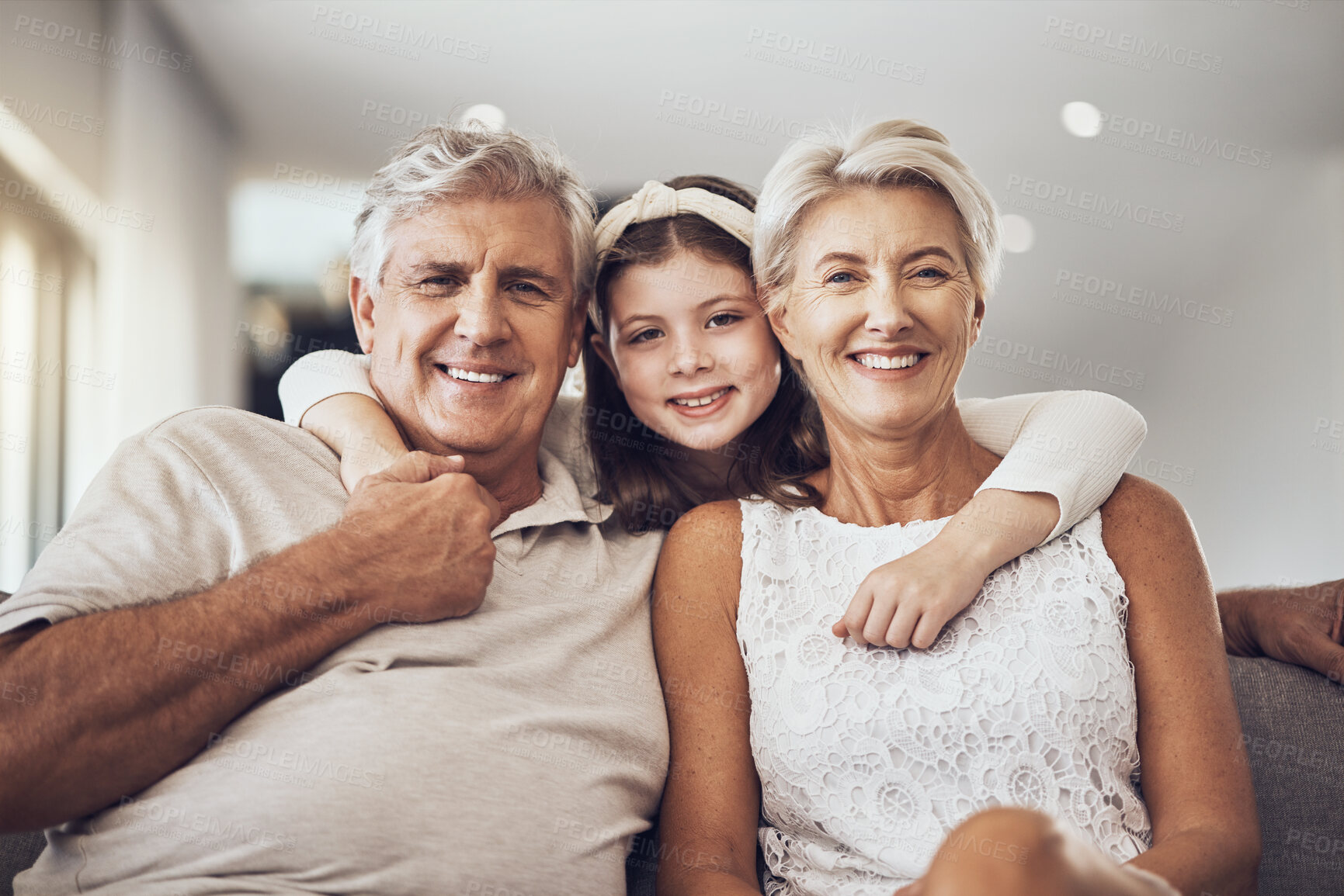 Buy stock photo Relax, portrait or grandparents hug a girl in living room bonding as a happy family in Berlin with love. Retirement, smile or elderly man relaxing old woman with child at home together on fun holiday