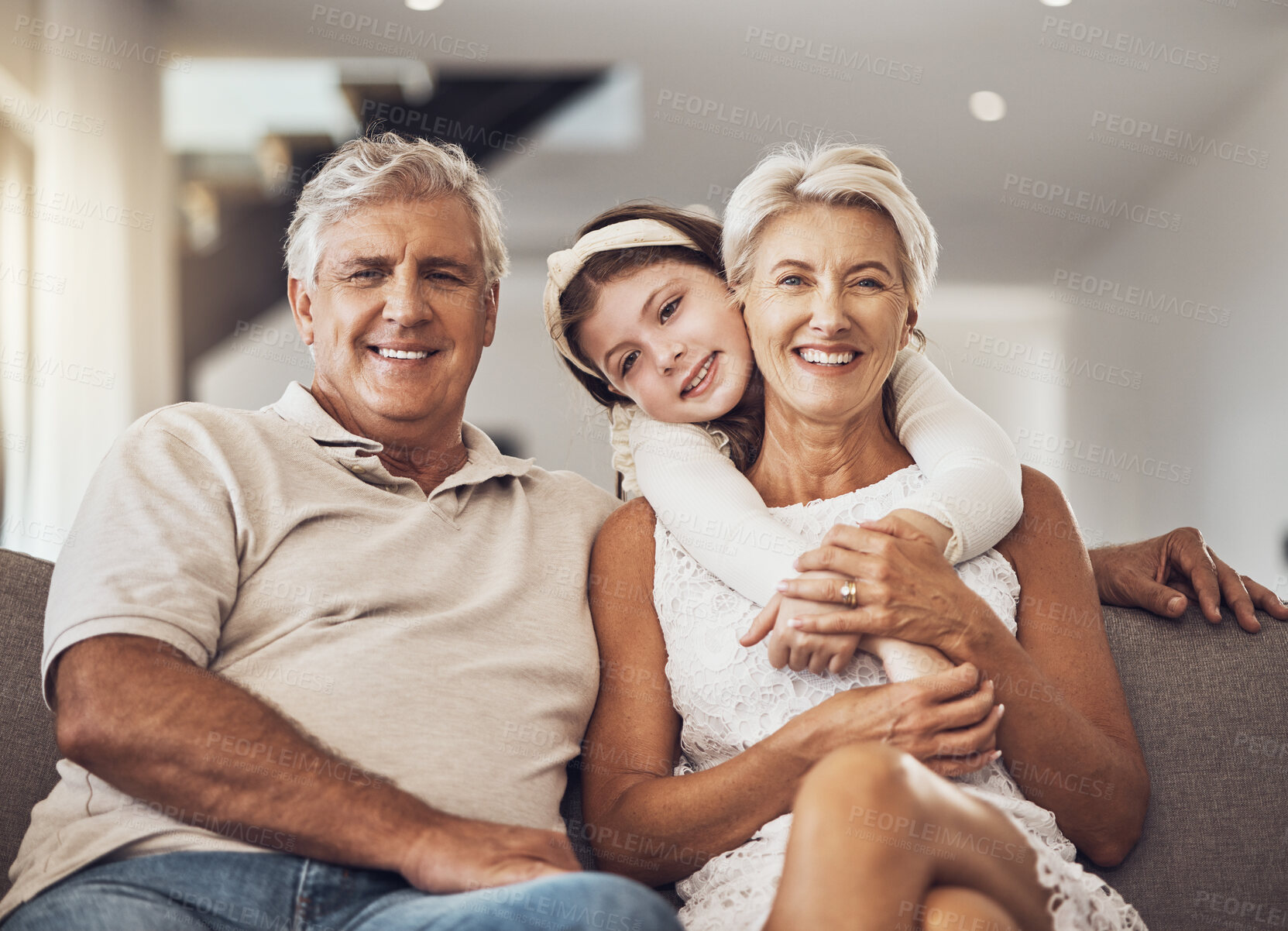 Buy stock photo Love, portrait or grandparents hug a girl in living room bonding as a happy family in Australia with care. Retirement, smile or elderly man relaxing old woman with child at home together on holiday 