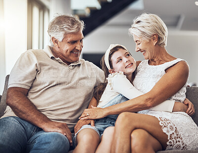 Buy stock photo Relax, happy or grandparents hug a girl in living room bonding as a family in Australia with love care. Retirement, smile or elderly man relaxing old woman with child at home together on fun holiday 