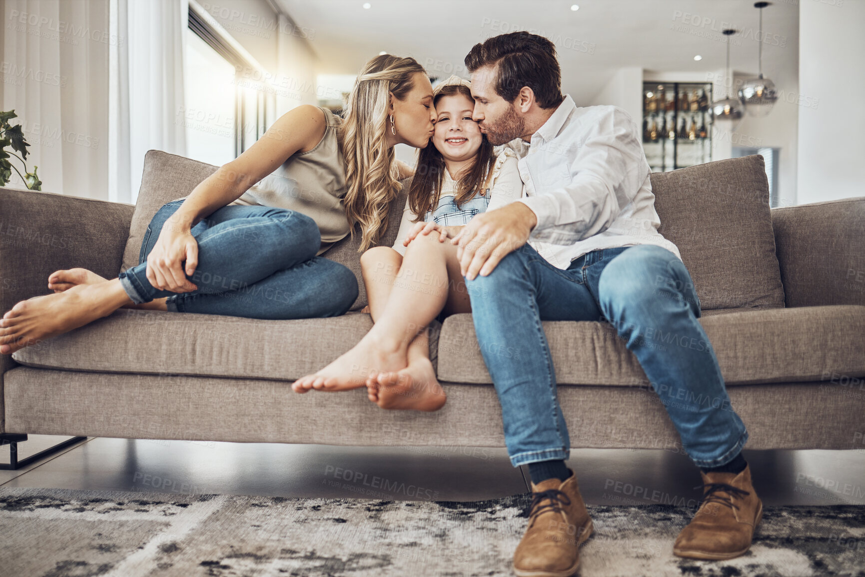 Buy stock photo Kiss, mother or father with a girl as a happy family in living room bonding in Australia with love or care. Child, young kid or parents relaxing with a smile enjoying quality time on a fun holiday 