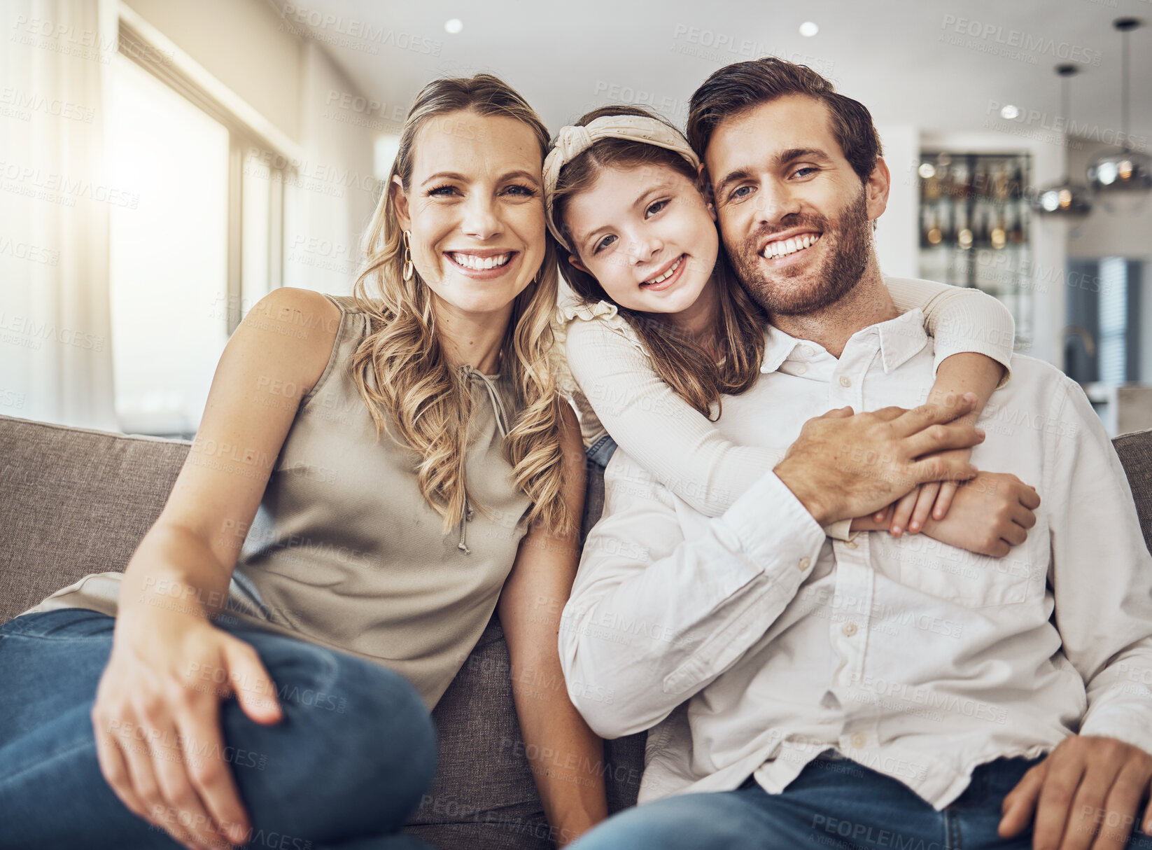 Buy stock photo Portrait, mother or father hugging a girl to relax as a happy family in living room bonding in Australia with love or care. Trust, embrace or parents smile with kid enjoying quality time on a holiday