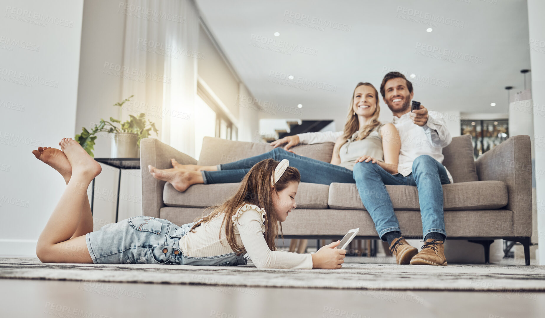 Buy stock photo Happy family, relax or child on tablet in living room, house or home live streaming, movies channel or internet show bonding. Smile, parents or kid girl on technology, television or watching tv media