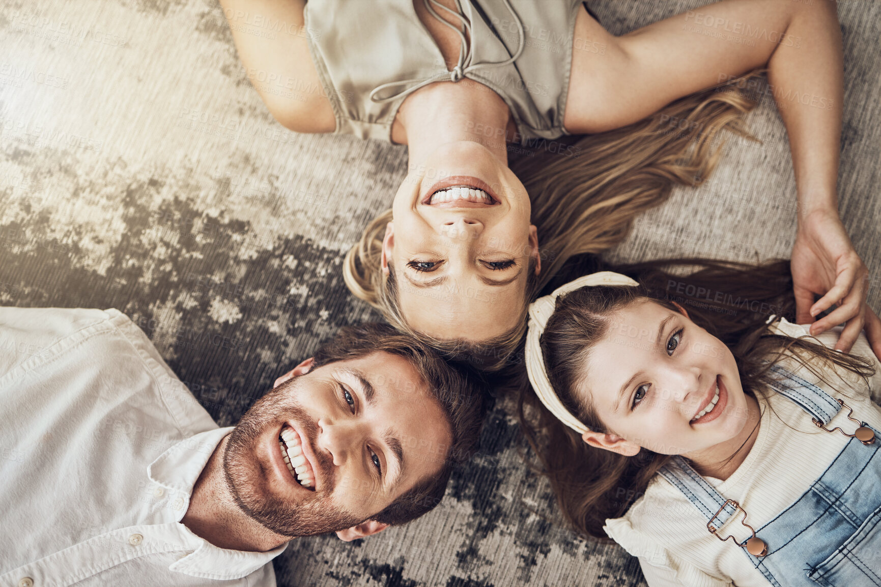 Buy stock photo Portrait, mother or father with a child on floor relaxing as a happy family bonding in Australia with love or care. Carpet, top view or parents smile with girl enjoying quality time on a fun holiday 