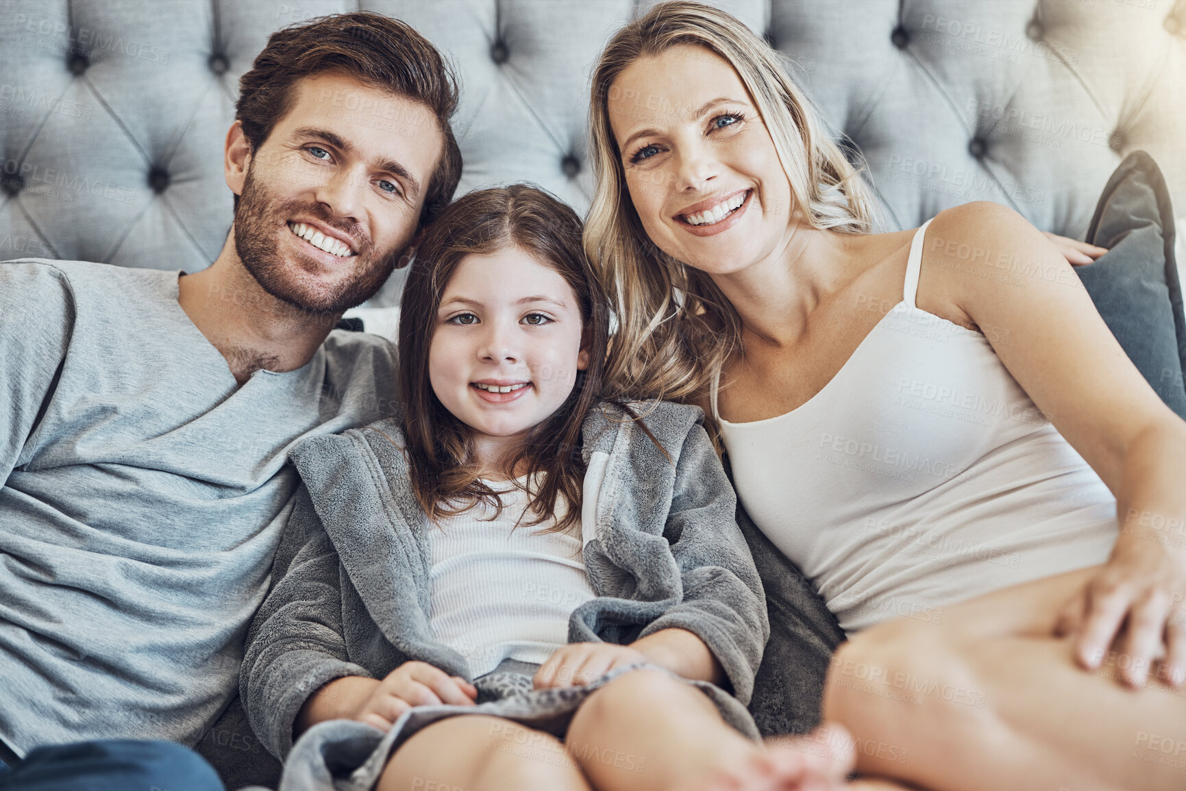 Buy stock photo Portrait, mother or father with a child in bedroom relaxing as a happy family bonding in Australia with love or care. Morning, face or fun parents smile with a girl enjoying quality time on a holiday