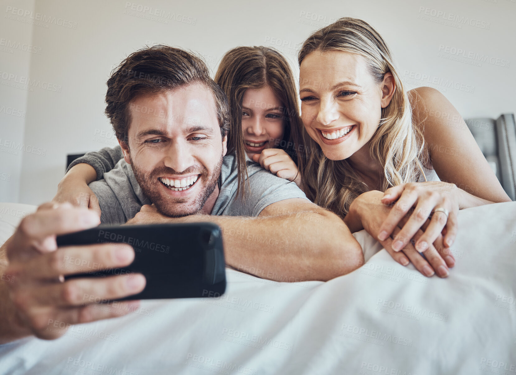 Buy stock photo Portrait, relax or parents take a selfie with a girl as a happy family in house bedroom bonding in Berlin. Mother, father or child relaxing together enjoying quality time or taking pictures at home