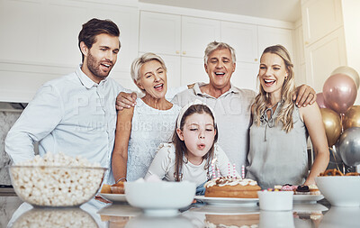 Buy stock photo Birthday, cake and big family with girl blowing out candles for wish, party or celebration event. Love, food and kid with happy father, mother and grandparents celebrating special day in home kitchen