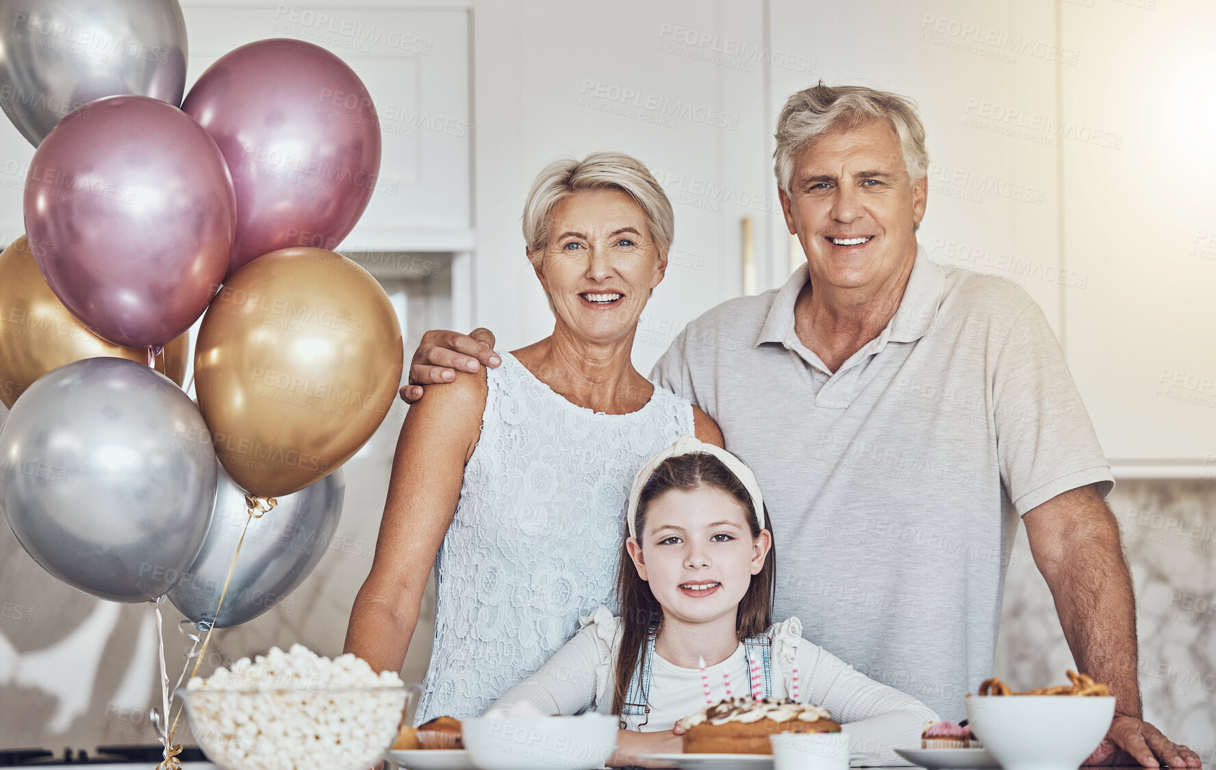 Buy stock photo Portrait, grandparents or girl in celebration of a happy birthday in house party or kitchen with popcorn or cake. Grandmother, old man or child bonding with love or care in family home to celebrate 