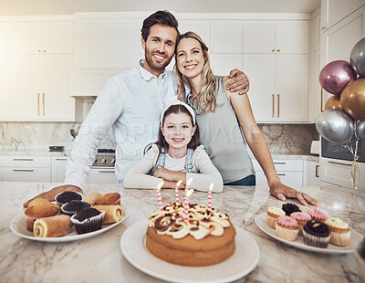 Buy stock photo Birthday party, cake and family portrait in kitchen for celebration event in house. Love, food and kid, girl or child with happy father and mother celebrating special day, care and bonding in home.