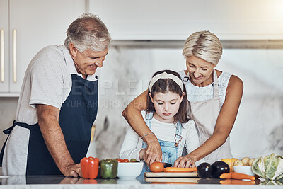Buy stock photo Learning, grandparents or girl cooking or cutting carrots as a family in a house kitchen with organic vegetables for dinner. Grandmother or old man helping or teaching child a healthy vegan food diet