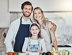 Portrait, parents or girl cooking as a happy family in a house kitchen with organic vegetables in vegan dinner. Mother, father or child love to bond or helping with healthy food diet for development
