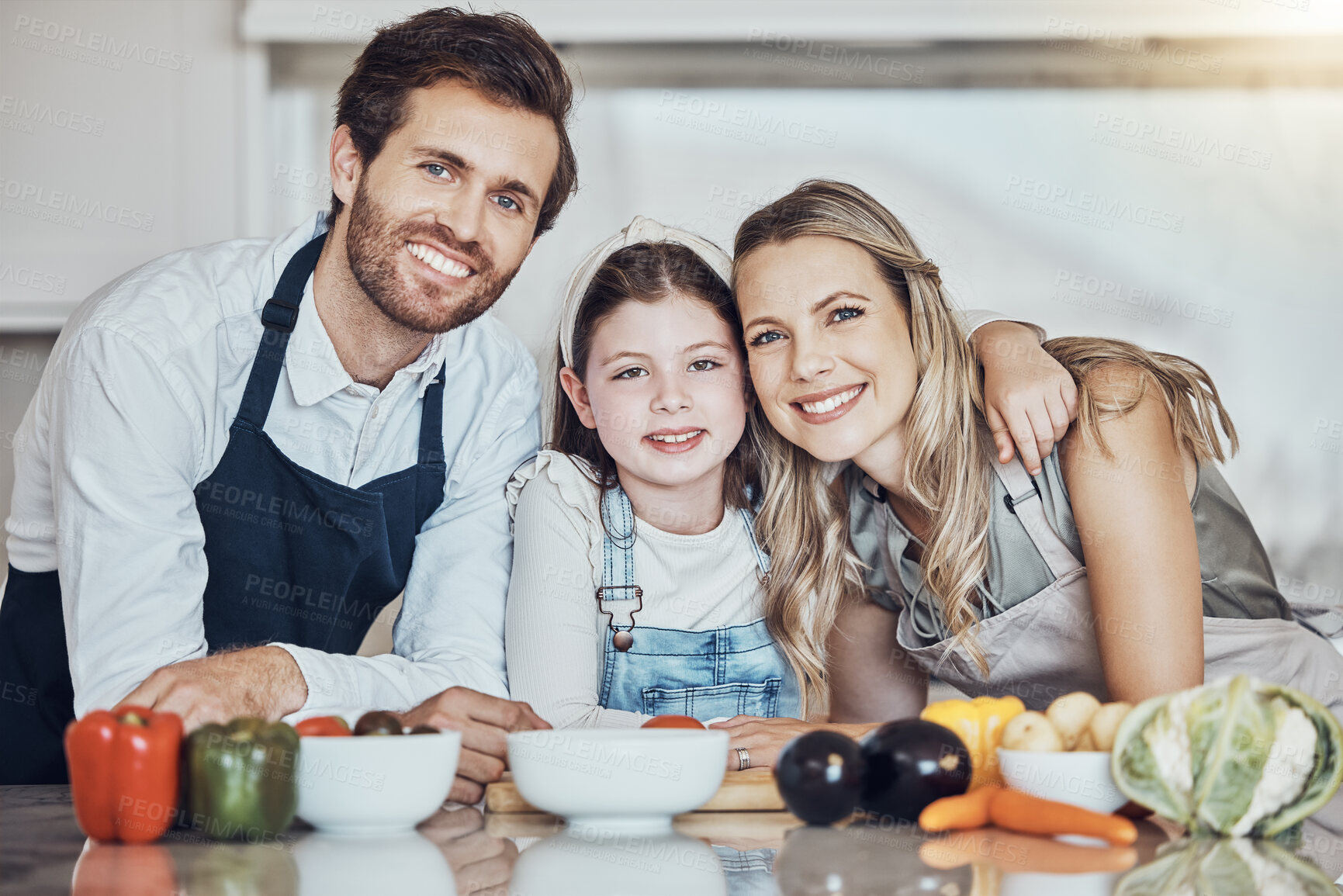 Buy stock photo Portrait, smile or girl cooking as a happy family in a house kitchen with organic vegetables in vegan dinner. Mother, father or child love to bond or helping with healthy food diet for development