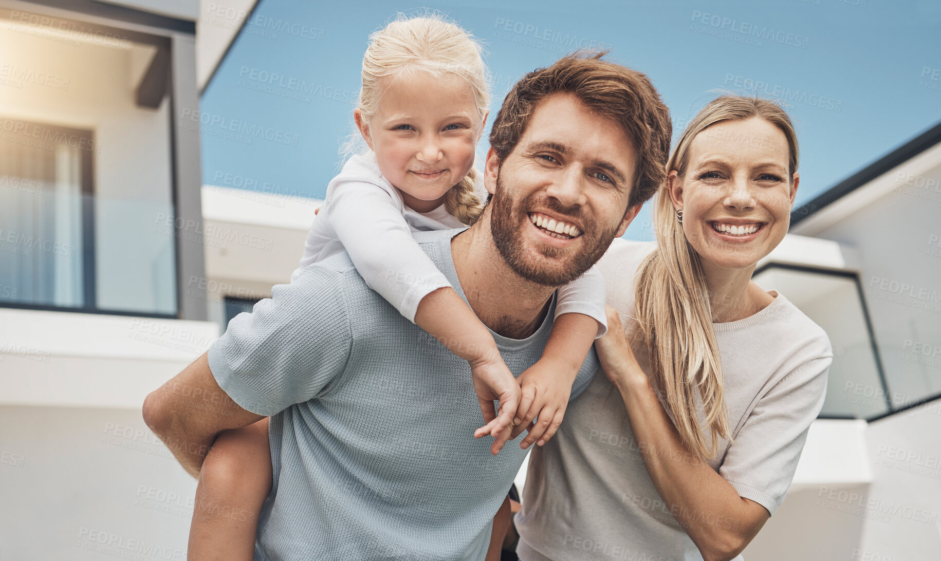 Buy stock photo Portrait, father carrying girl and mother with smile, outdoor and playful together in summer. Face, dad piggy back daughter or mother with joy, happiness or quality time for weekend break or vacation