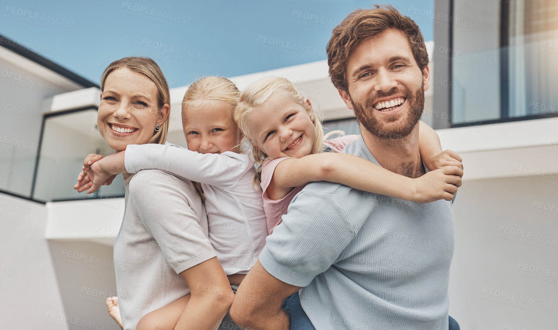 Buy stock photo Happy family, piggyback and real estate in new home, vacation or holiday break together bonding outside. Portrait of mom, dad and children on back with smile for house, apartment building or property