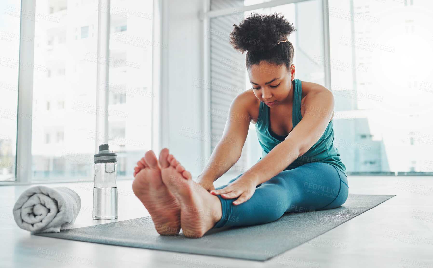 Buy stock photo Black woman, yoga and stretching exercise for fitness, health and wellness. Young person in pilates studio for workout, training and body balance with muscle warm up for healthy lifestyle motivation