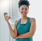 Water, bottle, black woman portrait and of a athlete in a gym after workout and sport. Hydration, drink and healthy young person in a wellness and health center with bottle for training and exercise 